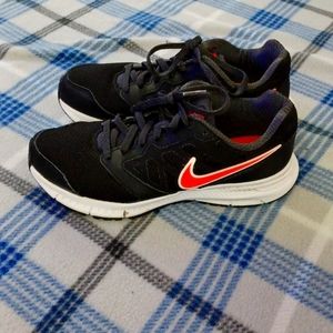 Red and black nike shoes